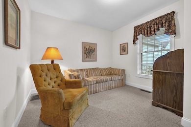 Cozy den just off the foyer-perfect for work, reading, or relaxing.