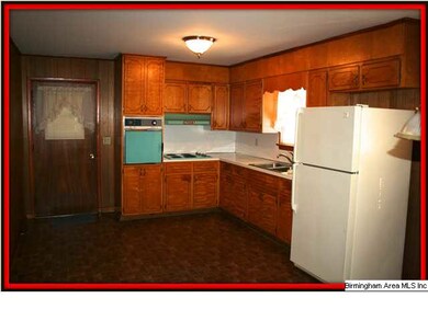 Another view of Kitchen.  Door leads to carport!