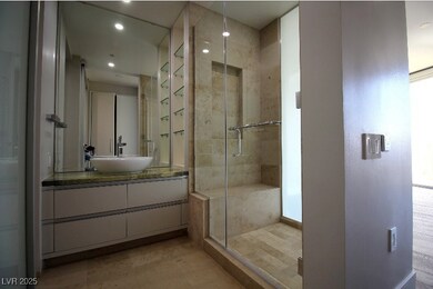 Bathroom featuring a shower stall, vanity, and rec