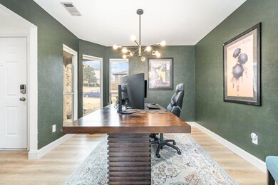 Office featuring light wood finished floors, baseb
