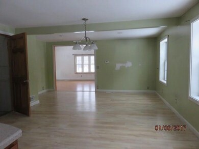 Large dining area with laminate flooring