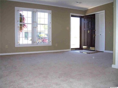 Looking back at front door from dining area, you see the light flooding in.