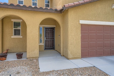 Inviting arched main home entryway with a wrought