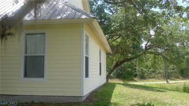Left side of home looking front-greenbelt on the r