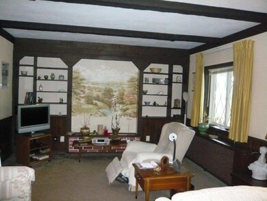 Living room with carpet and picture window to fron
