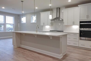 Kitchen featuring light hardwood / wood-style floo