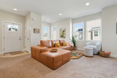 Living room featuring light carpet and recessed lighting