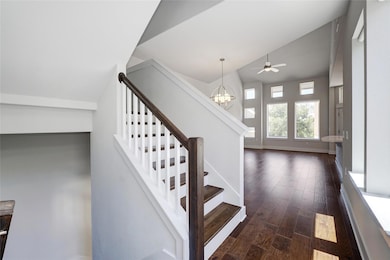 Stairway with baseboards, wood finished floors, l