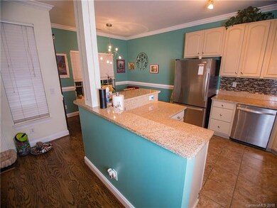 Kitchen with stainless steel appliances, custom ba
