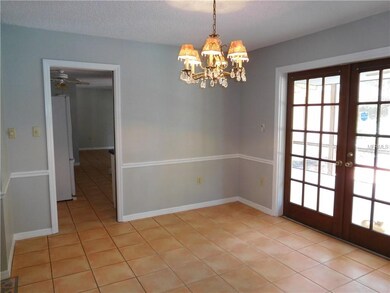 Formal dining room with French doors out to screen