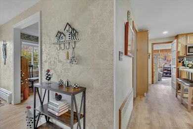 Front hall branches off to living room, dining room and hall way