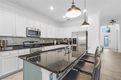 Kitchen featuring a breakfast bar area, an island