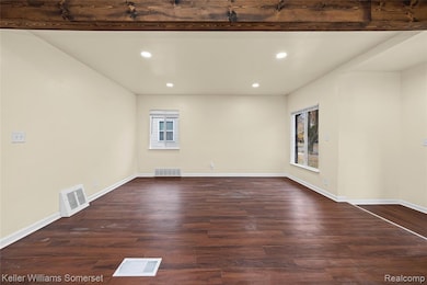 Unfurnished room featuring recessed lighting and dark wood-style floors