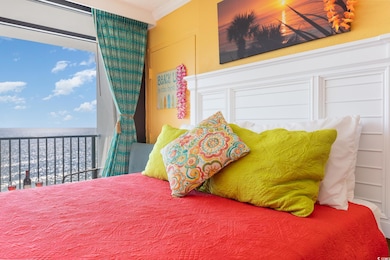 Bedroom featuring ornamental molding and a water v