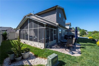 Seller added a screened porch with cathedral ceilings and decorative patio