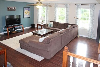 Living Room so spacious with hard wood!