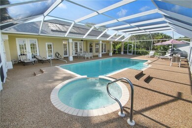 View of swimming pool with glass enclosure, an in