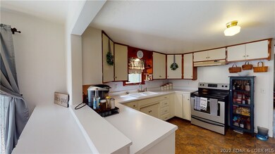Open Kitchen w/ Breakfast Bar.