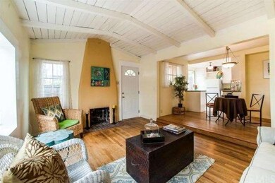 Authentic fireplace is focal point of this cute be