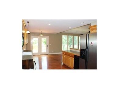 Kitchen and Dining Area With French Doors to Walk-