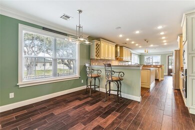 This 2 sided open concept kitchen has 2 bar areas