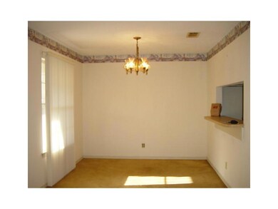 Photo. Dining room with pass through window to kit