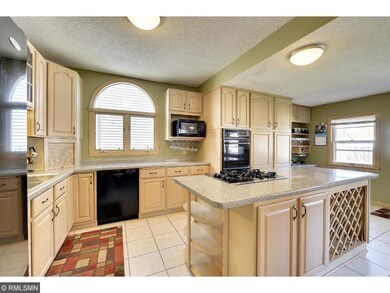 Spacious kitchen with tile floors and generous cab