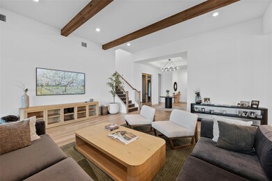 Living room with recessed lighting, beam ceiling,