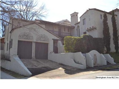 Side of large home features rare attached 2-car ga
