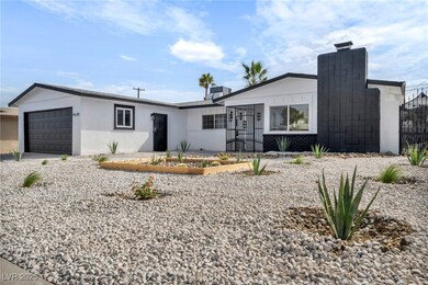 View of front of property with brick siding, an at