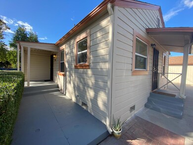 kitchen side door and front door with covered porc