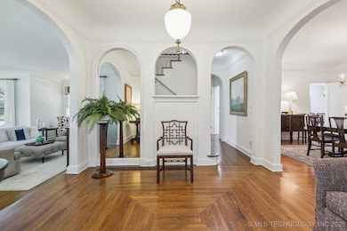 Foyer with living area to the left, formal dining
