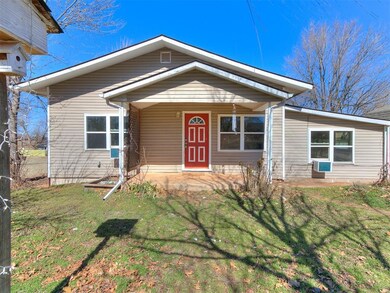 View of front facade featuring covered porch and a