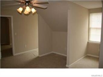 The front bedroom has a nook for a desk or dresser