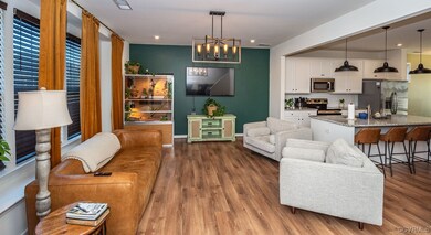 Living room featuring a chandelier and hardwood /