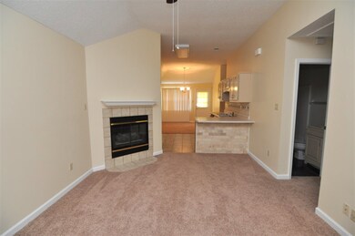 A cozy fireplace highlights the great room to enjo