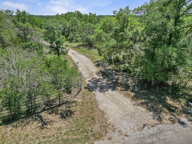 View of road featuring a rural view and a wooded 