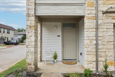Entrance to property with stone siding