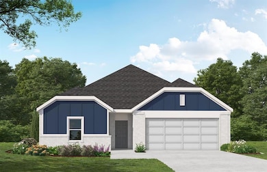 View of front of house with a garage, brick siding