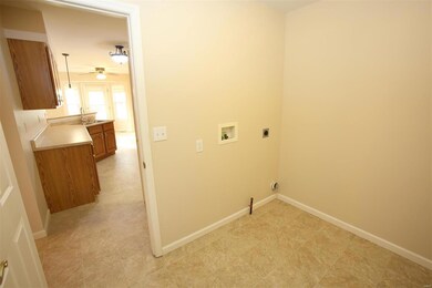 Main floor laundry with closet & electric/gas hook