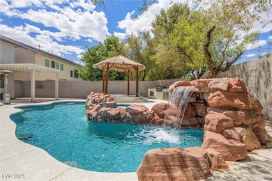 View of pool featuring a fenced backyard, a gazebo