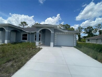Ranch-style home featuring stucco siding, a garage