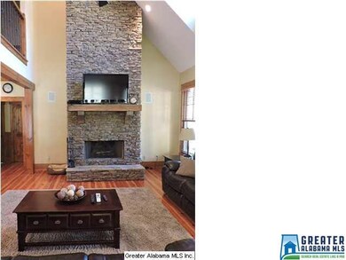 Stacked stone wood burning fireplace with gas igni