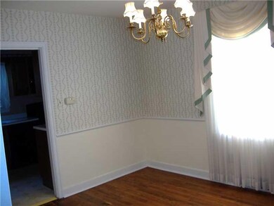 Dining Room. HW, chair rail and two windows ready 