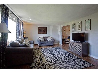 Spacious bright living room with newer hardwood fl