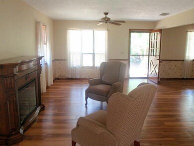 Living Room. Fireplace and Wood Laminate Flooring