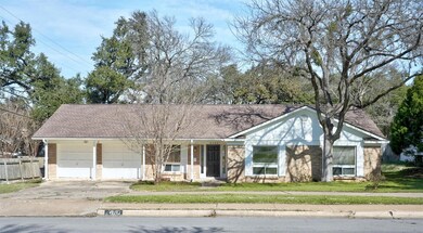 View of front of property featuring concrete driv