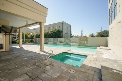 Pool area with hot tub.