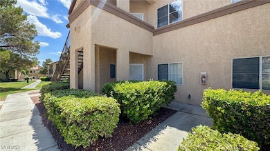 Property entrance featuring stucco siding