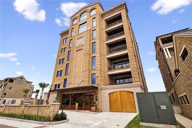 Classic brickwork meets modern elegance featuring arched windows, grand entryway, and refined historic architectural detailing.